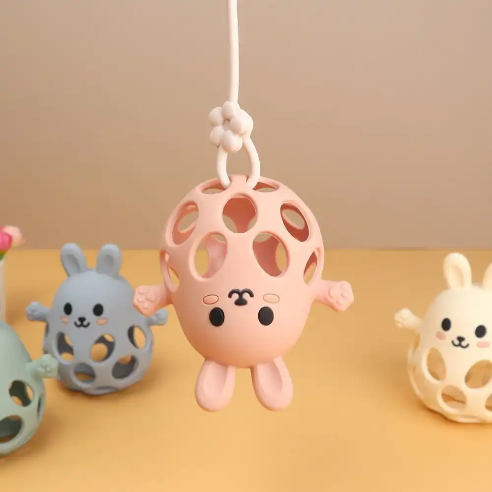 baby using silicone chick rattle teething toy