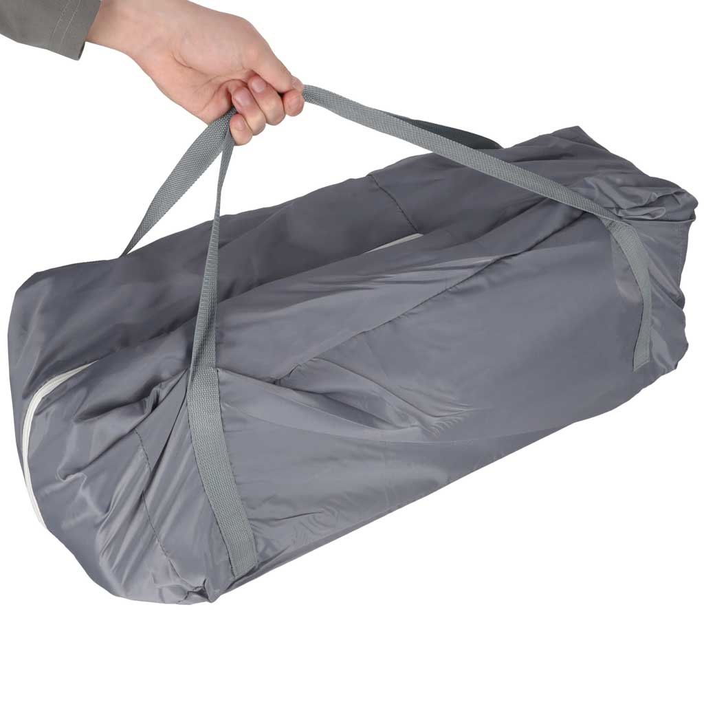 Cuna de viaje para bebé guardada en su bolsa de transporte con asas